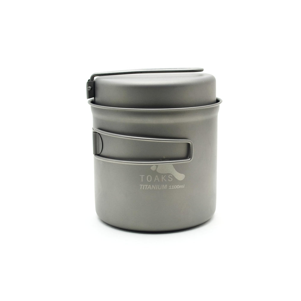 TOAKS Titanium 1100ml pot closeup shows ultralight durability for backpacking meals.