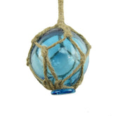Light blue glass float buoy hanging from a nautical rope