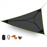 Triangle Hammock shows quick, sturdy setup in backyard for outdoor relaxation.