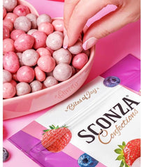 Triple Berry Yogurt Creme bites close-up shows yogurt coating and vibrant berries for a gourmet snack.