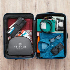 TRIPPED Granite Grey 35L Backpack open showing spacious main compartment for gear and camera