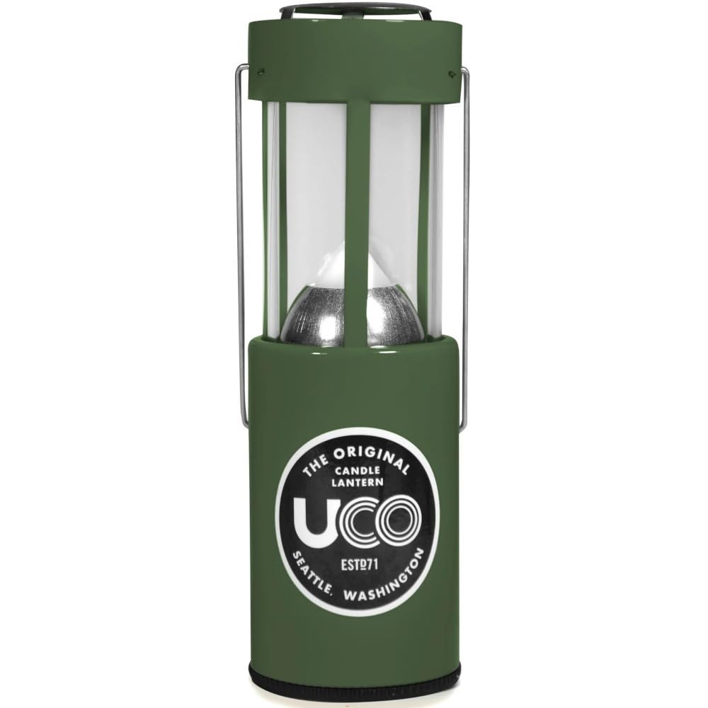 UCO 24352 candle lantern in use providing warm ambient light outdoors.
