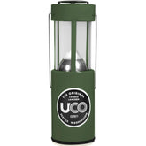 UCO 24352 candle lantern in use providing warm ambient light outdoors.