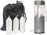 UCO Original Candle Lantern front view glowing softly for campsite ambiance