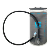 Ultimate Direction water reservoir with straw integrated for on-the-trail hydration.