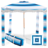 Umbrellissimo Beach Cabana Blue Ombre on the beach providing cool shade in sunset light