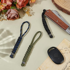 Close-up of UNICRAFTALE paracord knife lanyard assembly showing durable weave.