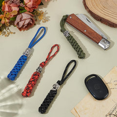 UNICRAFTALE paracord knife lanyard closeup showing durable metal beads and premium grip.