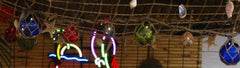 Upper Deck glass floats on display, a tiki bar-ready coastal centerpiece.