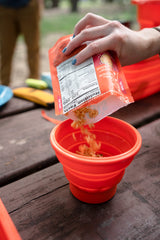 ust FlexWare Bowl Orange used as a pet water bowl on the go