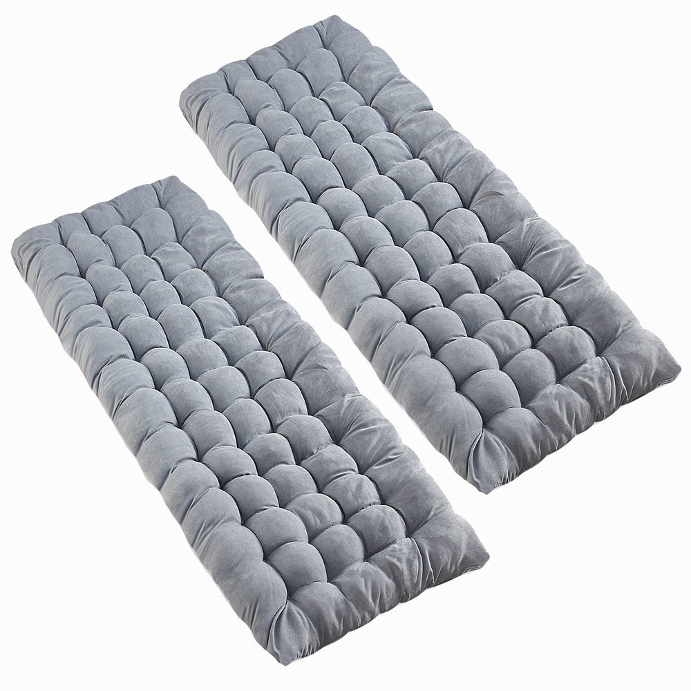 VaygWay grey camping cot pad folded for compact portability during travel and hikes.