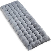VaygWay grey cot pad laid out for a comfy night outdoors