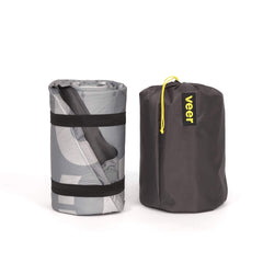 Veer Air Pad folded in storage bag demonstrates portability.