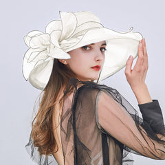 Side view of the flower accent on vintage cloche hat.
