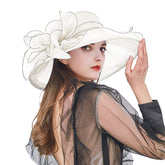 Vintage cloche hat with flower detail for elegant tea parties.