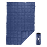 Wakeman down camping blanket folded in its bag for ultra-compact travel.