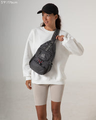 Waterfly Packable Sling Bag grey exterior demonstrates practical organization for quick access on the go.