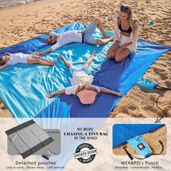 WEKAPO beach blanket corner pockets used for items and anchor.