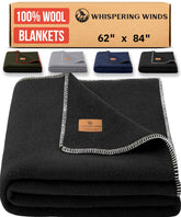 Whispering Winds 100% wool blanket folded on bed delivers warm, cozy comfort for late-night reading.
