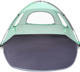 WhiteFang Beach Tent anti-UV shade on sunny beach with UPF 50+ protection.