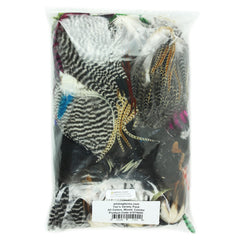 Whiting Farms Fly Tier's Variety Pack feathers close-up showing Grizzly, Brown, Dun, and Black options for patterns