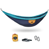 WHTE MOSS Suparpine II hammock setup in deep blue for easy outdoor lounging on a sunny campsite