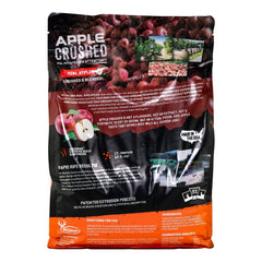 Wildgame Innovations Apple Crushed pour-ready attractant being poured into a feeder area