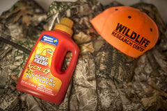 Scent Killer Gold HE formula bottle showing compatibility with standard and HE washers.