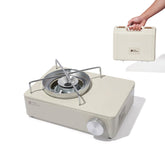Windhike stove with open top cover for easy gas tank changes during camping.