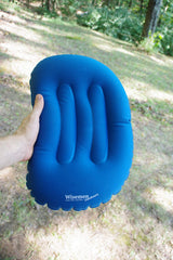 Wisemen Outdoors ultralight pillow showing inflation valve for quick setup.