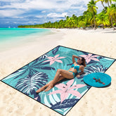 WIWIGO Beach Blanket fully spread on sand, roomy for family picnics outdoors.