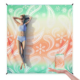 WIWIGO Beach Blanket with anchors keeps the mat secure on windy beaches