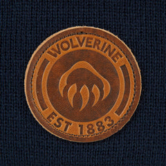 Wolverine watch cap worn outdoors during outdoor activity.