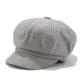 Light gray women's beret newsboy hat worn by model