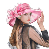 Women Church Hat hot pink with flower detail, perfect for weddings and tea parties.