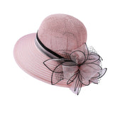Womens party derby hat with organza pink flowers for garden parties.