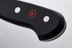 Wüsthof Classic 6-inch Utility Knife chopping onions with ease.