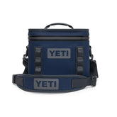 YETI Hopper Flip 8 Navy open shows easy access and compact portability for outdoor trips.