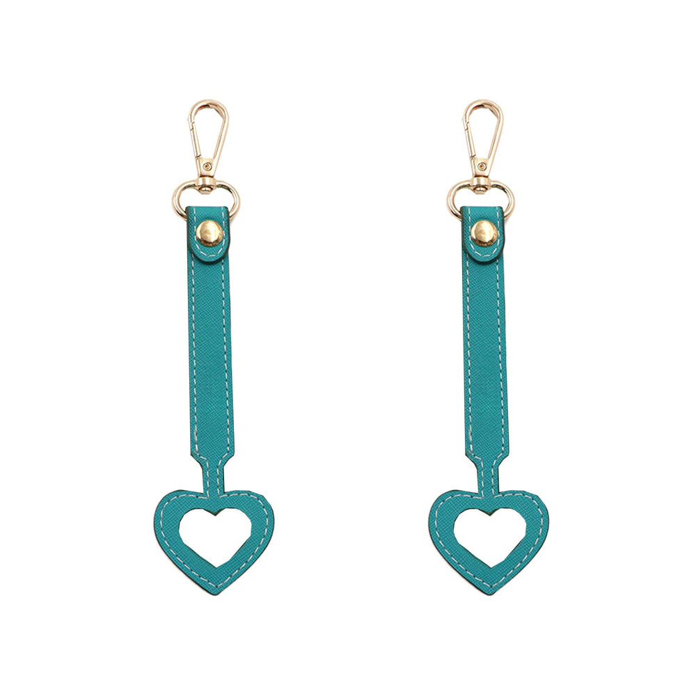 YEZILUU heart-shaped hat clip in dark blue vegan leather demonstrates secure hands-free storage.