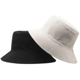 Front view of YTNKIV oversize bucket hat in black and beige