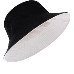 Reversible YTNKIV bucket hat displaying both black and beige sides