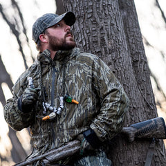 Zink Nothing But Green polycarbonate duck call hand-tune in field setting highlighting customizable sounds.
