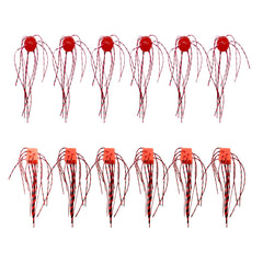 Red and pink silicone round and dice-shaped fishing lures set with multi-strand skirts