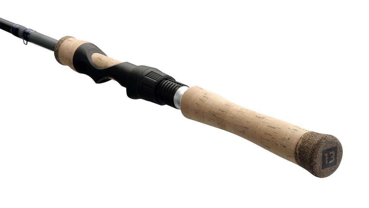 13 FISHING Defy Silver 6'6 UL spinning rod in-hand display balancing the rod.