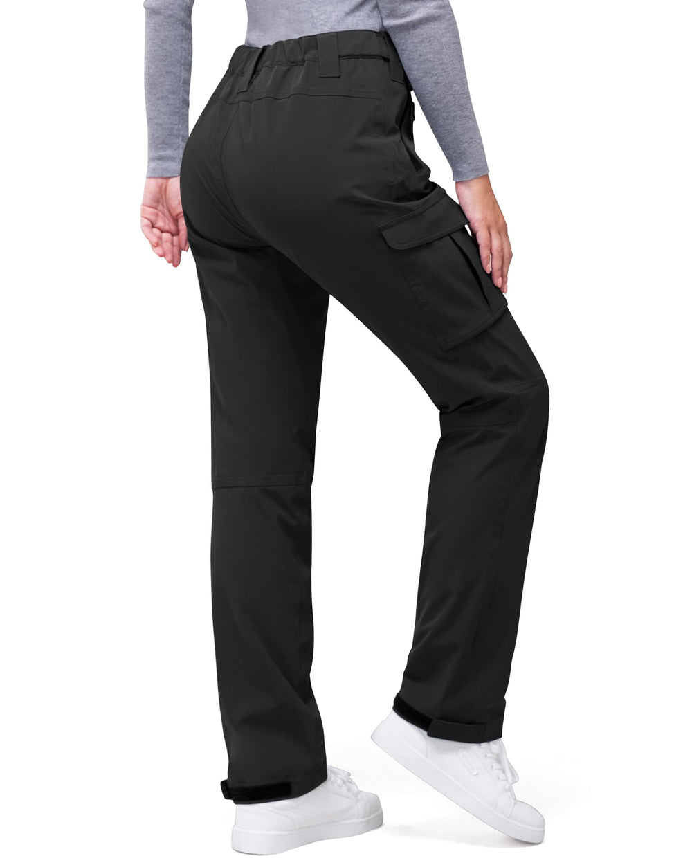 33,000ft women's rain pants pocket detail highlights secure storage on hiking trips