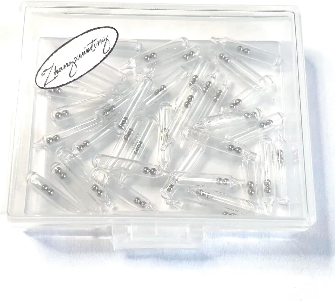 Materials: glass rattles and steel balls