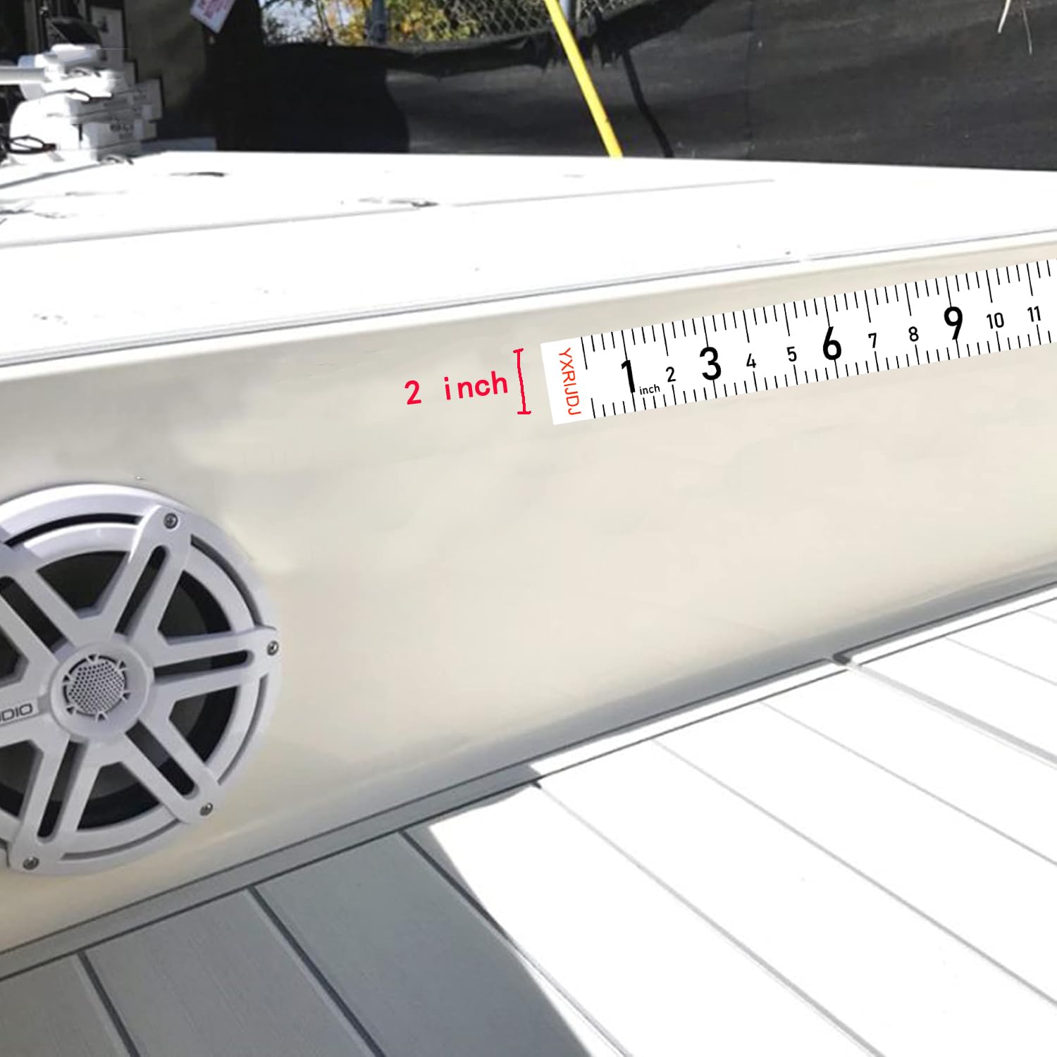 Ruler sticker applied on boat, dock, and kayak surfaces