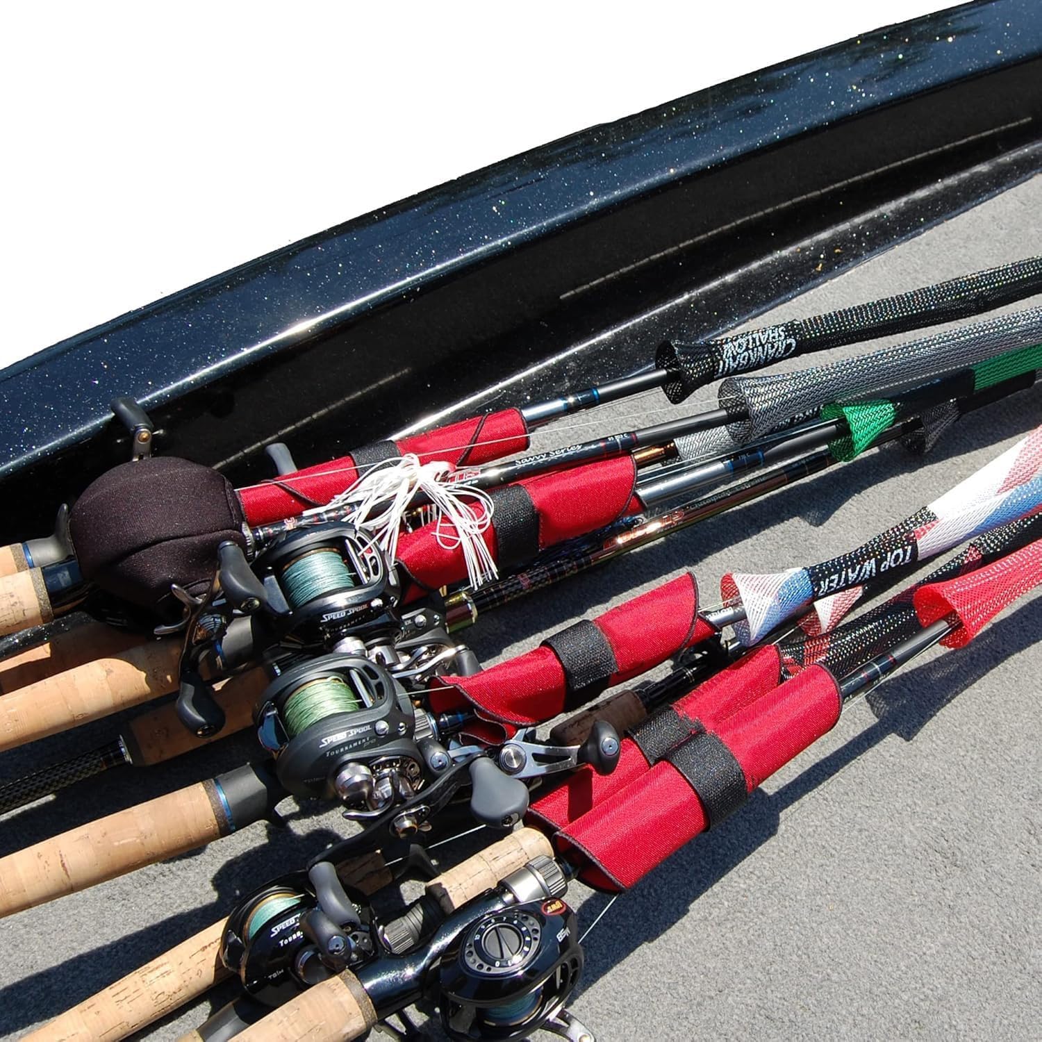 Angler using lure wraps on a fishing rod for safe organized fishing