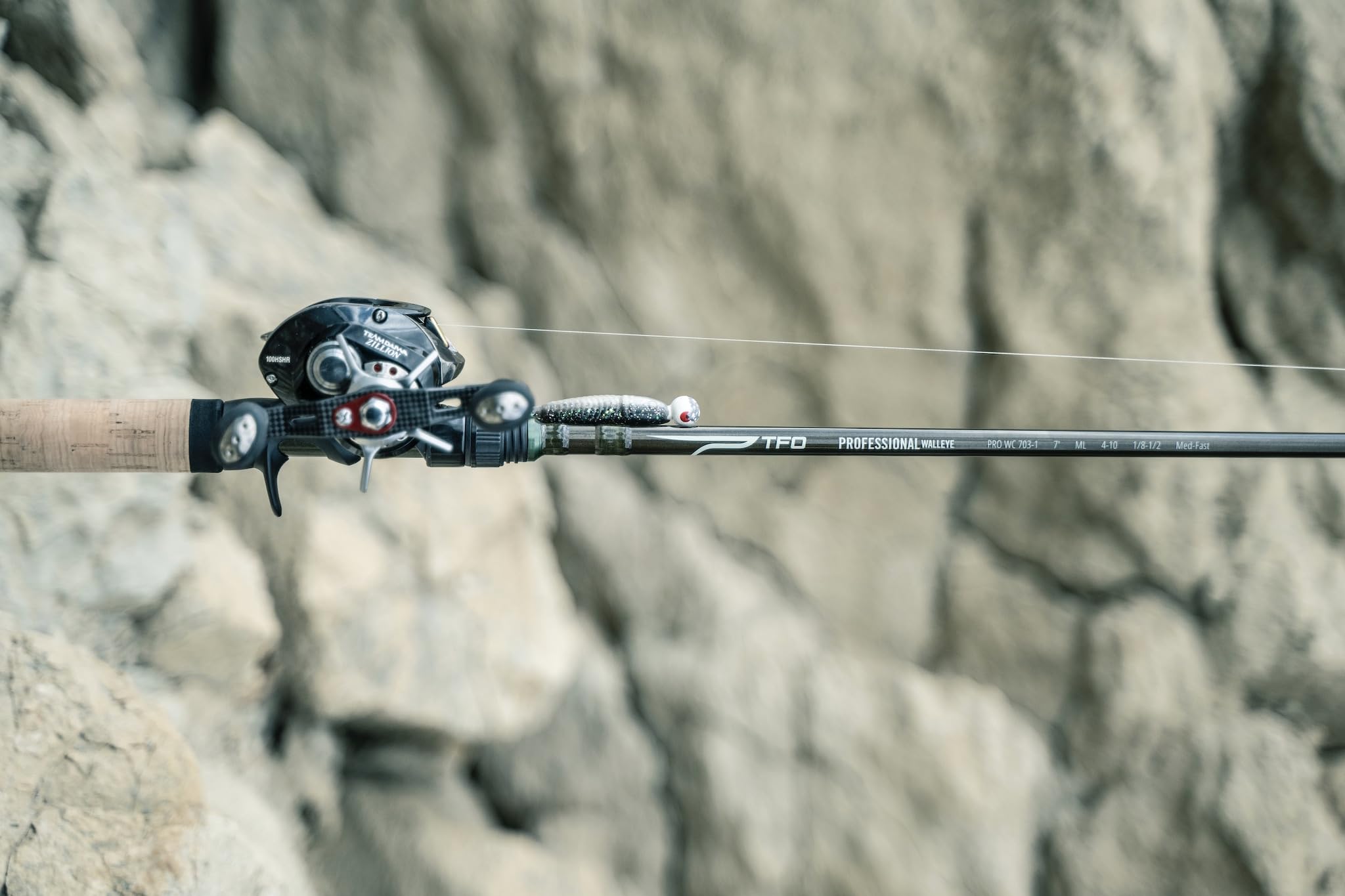 Rod in casting configuration emphasizing jigging action