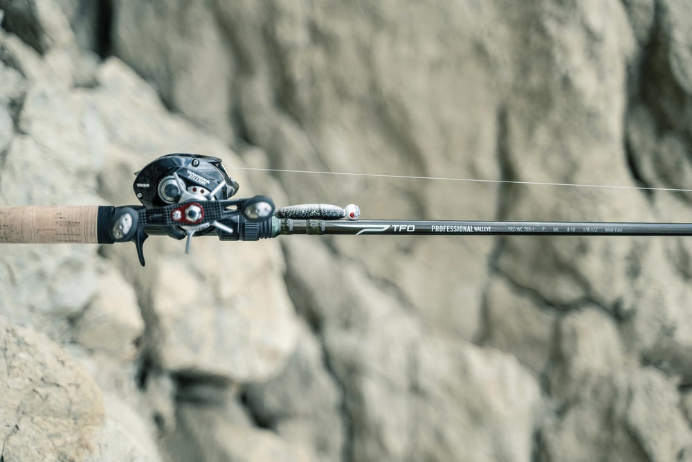 Rod in casting configuration emphasizing jigging action